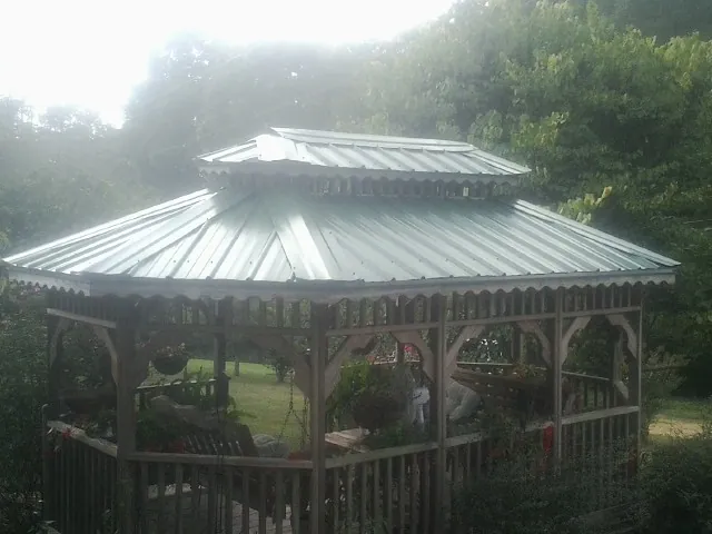 Two tier green metal roof on a garden gazebo in Glen Wild